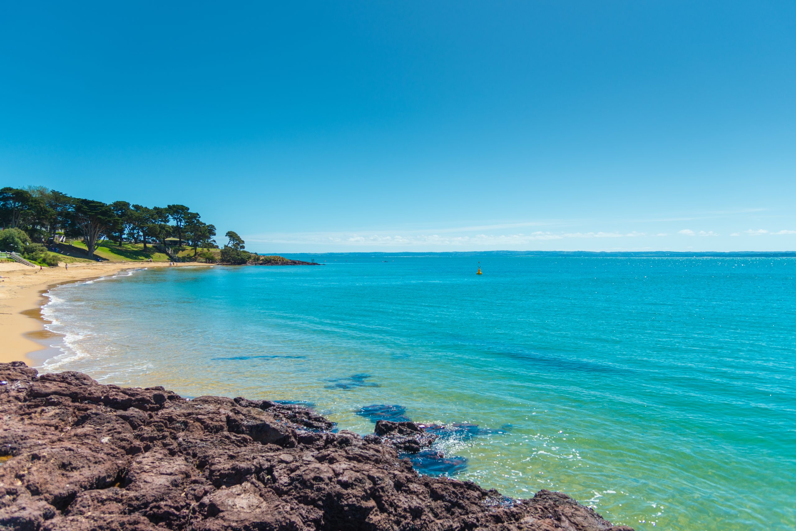 Bright blue waters of Phillip Island, Australia where you can swim in the calm waters of the beaches of Victoria and see penguins.